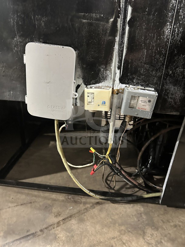 Rear view of commercial stainless steel refrigerator/freezer model 14-S96, showing wiring and attached electric controls.