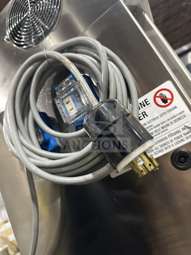 Selmi 2016 Futura EX Series stainless steel chocolate tempering machine, Model FUTURA, with visible electric cord and safety label.