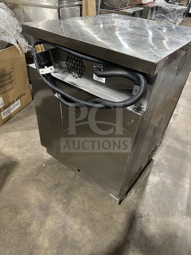 Winston Industries Cvap Silver Edition stainless steel undercounter Cook-N-Hold oven, Model CAT509GJ, 208V, on casters.