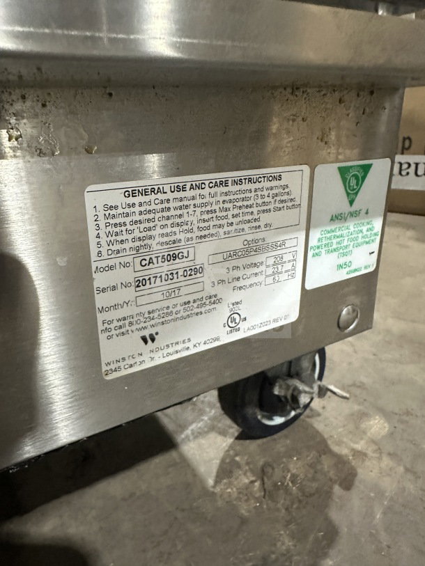 Winston Industries Cvap Silver Edition CAT509GJ stainless steel undercounter oven, 208V 3 Phase, on casters, with label.