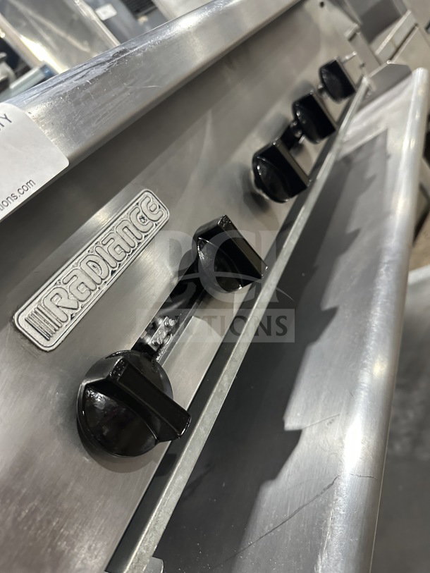 Radiance stainless steel 36" gas char broiler with individual controls, cast iron grates, and mounted on a steel stand.