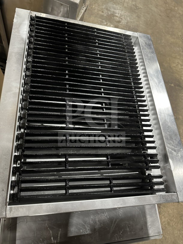 Radiance Turbo Air 36" stainless steel gas char broiler with cast iron grates, individual controls, on legs and stand.