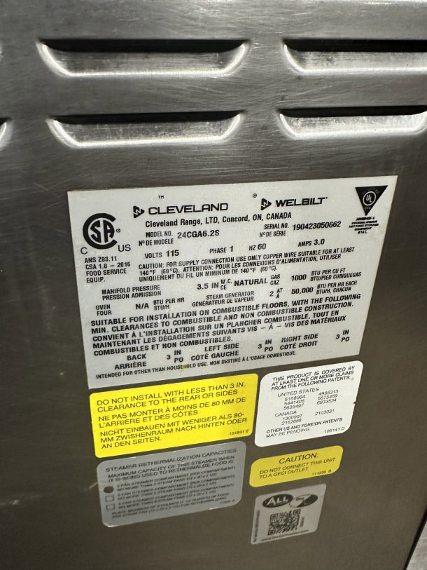Cleveland Range commercial stainless steel dual compartment convection steamer, model 24CGA6.2S, natural gas, SureCook controls, built-in pan racks, 115V 1 phase, serial number 190423050662, on legs.