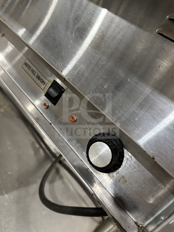 Eagle Group stainless steel underbar cocktail/ice bin with auto fill on/off switch and dial. Appears used, on sturdy legs.