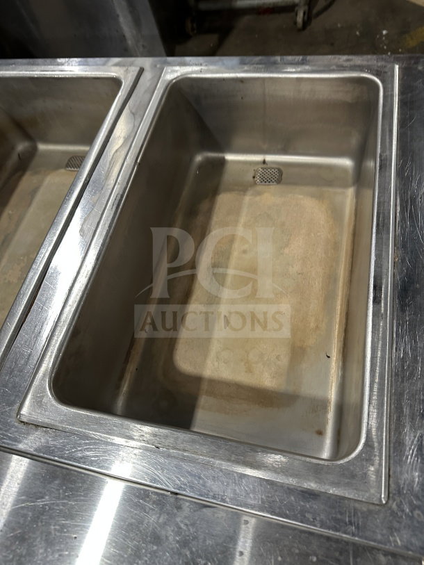 Eagle Group stainless steel underbar cocktail/ice bin with legs, used condition, features drainage and sturdy construction.