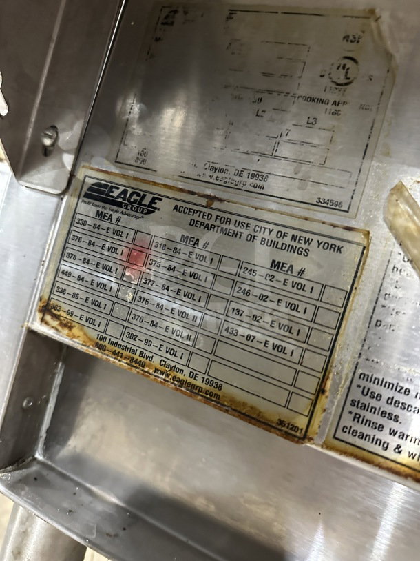 Eagle Group stainless steel underbar cocktail/ice bin with legs, showing manufacturer's label and NYC use acceptance.