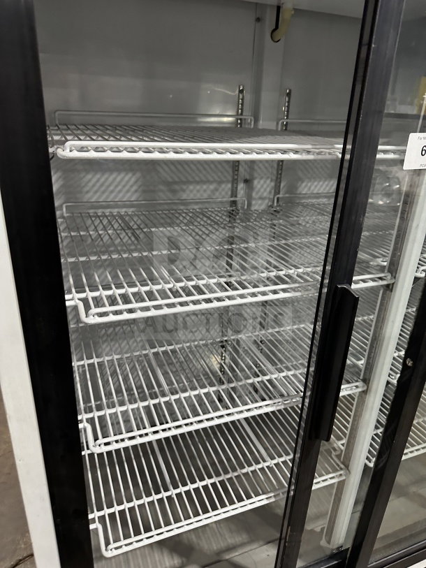 Maxx Cold commercial black double glass swing door merchandiser freezer, model MXM2-48S, with poly-coated wire racks.