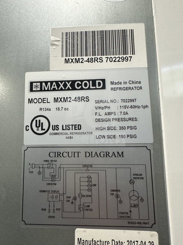 Maxx Cold commercial freezer model MXM2-48RS label showing specs: 115V, 7.0A, R134a refrigerant, UL listed, circuit diagram.