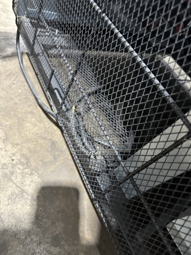 Alt text: Close-up of Maxx Cold Commercial Freezer, showing poly-coated wire rack and wiring behind a mesh cage. Model: MXM2-48S.