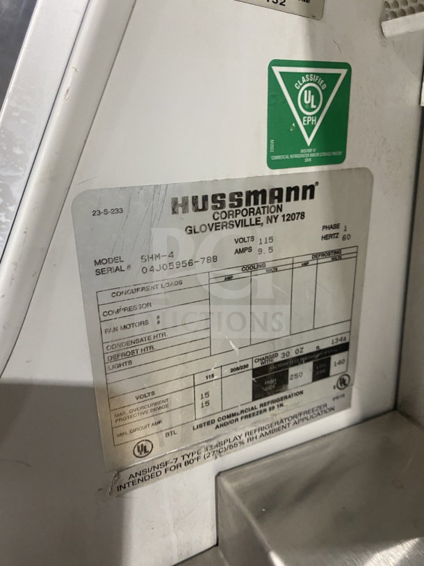 Hussmann SHM-4 merchandiser label, SN 04J05956-788, displaying electrical specs: 115V, 1 phase, UL classified.