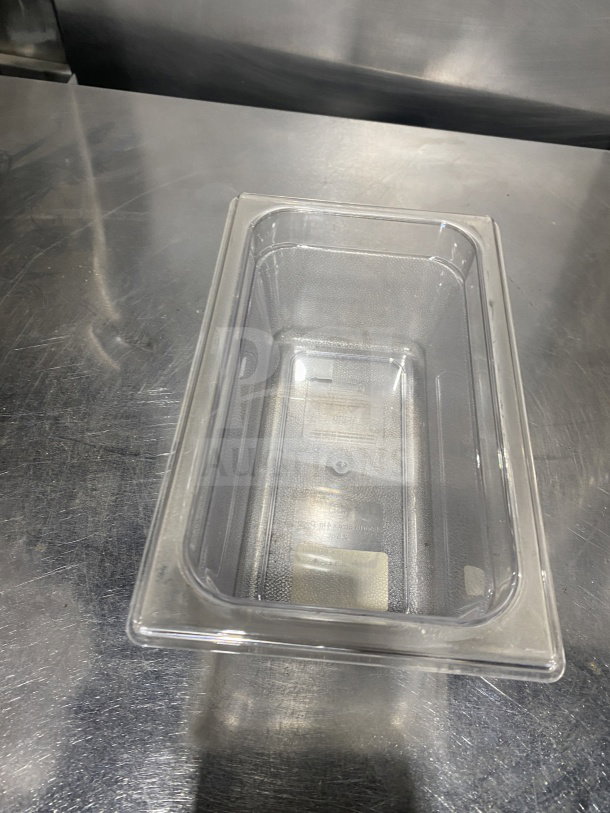 Rubbermaid 4" transparent food pan, model 339600, made of durable polypropylene; commercial use, excellent condition.