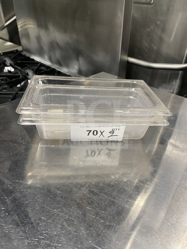 Rubbermaid 339600 Commercial Polypropylene Fourth Size Transparent Food Pan, new condition, clear with visible auction label.