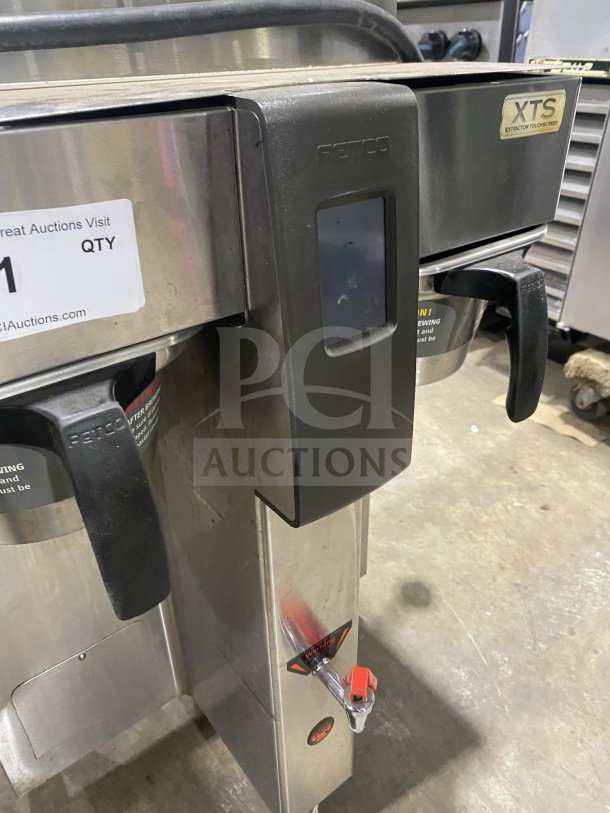 Fetco CBS2142XST stainless steel twin coffee brewer, electric, 200/240V, 1 phase, touchscreen, on legs, good condition.