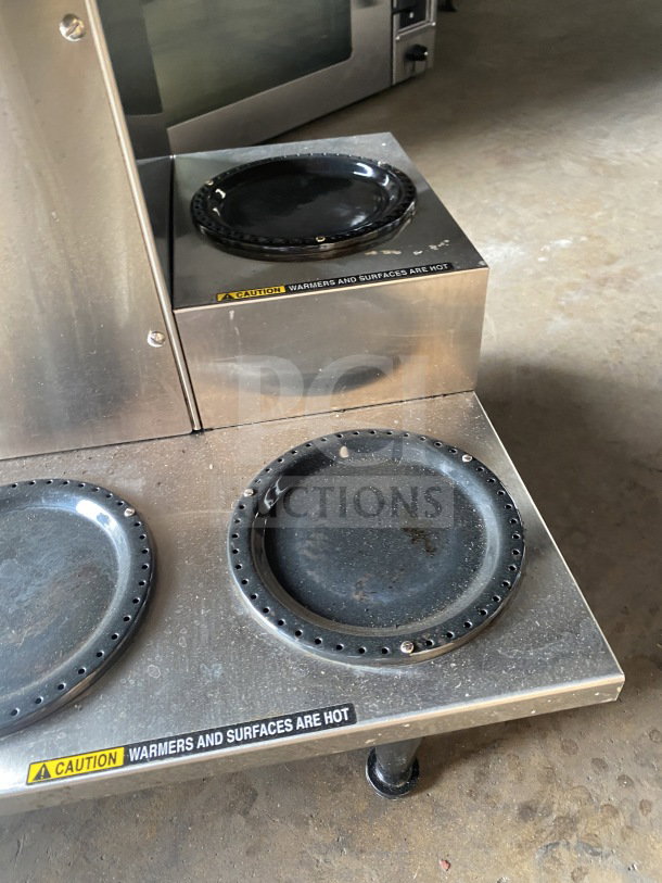 Bunn AXIOM 0/6 TWIN commercial coffee brewer with 6 warming plates, stainless steel brew basket, and hot water dispenser.