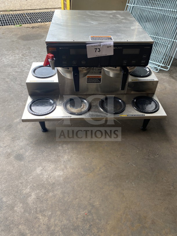 Bunn AXIOM 06 TWIN coffee brewer, stainless steel, 6 warming plates, hot water dispenser, brew basket, on legs.