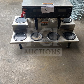 Bunn AXIOM 06 TWIN coffee brewer, stainless steel, 6 warming plates, hot water dispenser, brew basket, on legs.