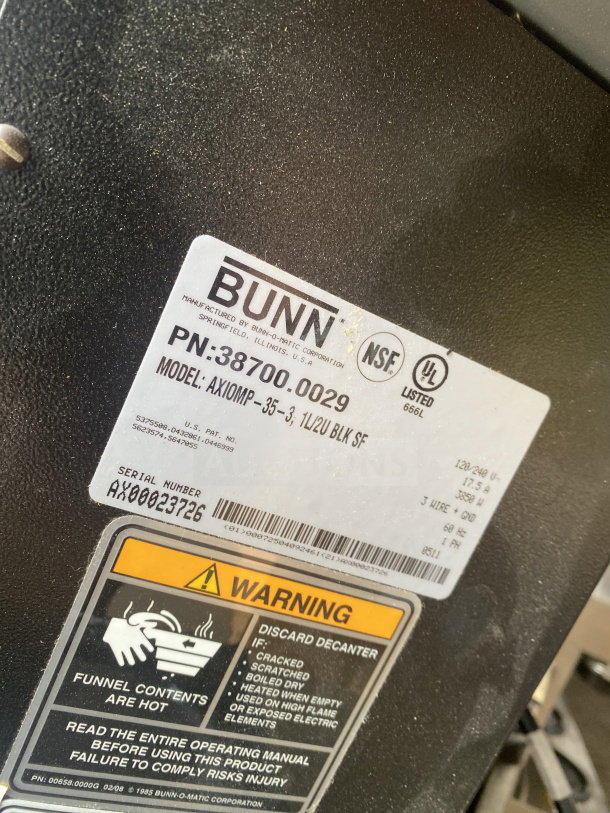 Bunn AXIOMP353 coffee brewing machine label, featuring model and serial numbers, electrical specifications, and safety warnings.