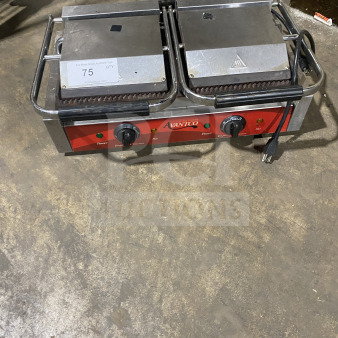 Avantco stainless steel electric double countertop panini grill with grooved cast iron plates, red control panel, visible wear.