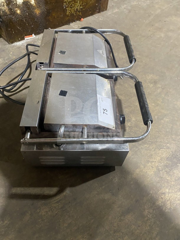Avantco commercial stainless steel electric double panini grill with grooved cast iron plates, visible wear, labeled "75".