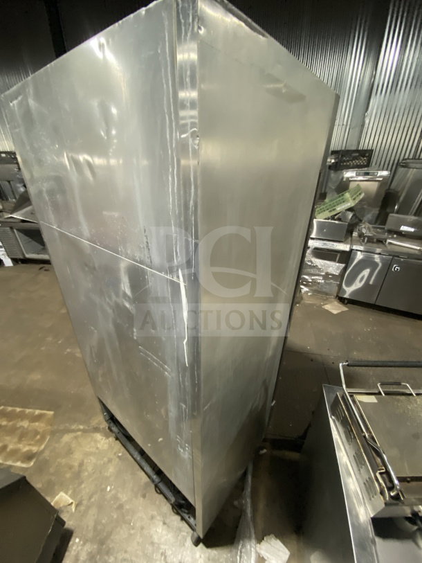 True T-35 stainless steel 2-door reach-in refrigerator on casters, with poly coated wired rack, 115V 1 Phase, SN: 6828224.