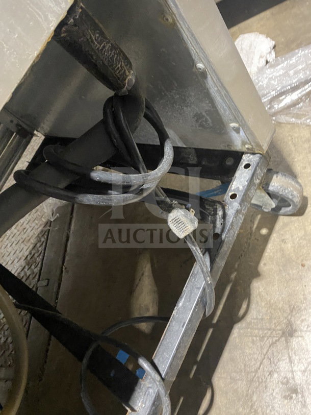True T-35 2-door stainless steel commercial refrigerator on casters, shown with poly-coated rack and power cord. Model SN: 6828224.