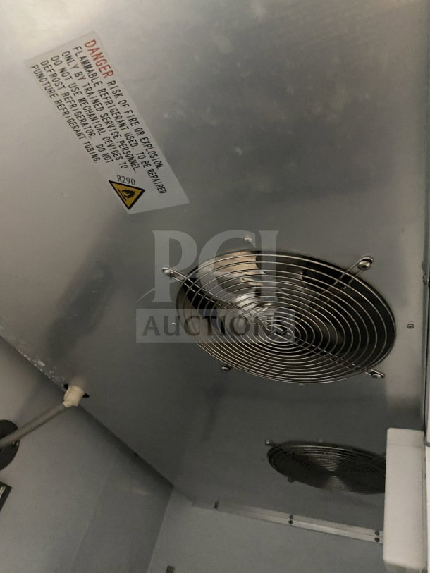 Avantco stainless steel reach-in freezer, model 178A49RHC, with dual fans and safety label.