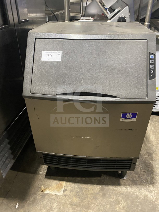 Manitowoc stainless steel undercounter ice maker, model UYF0140A-161B. Features air-cooling, electric-powered, 115V, 1 phase. Visible wear.