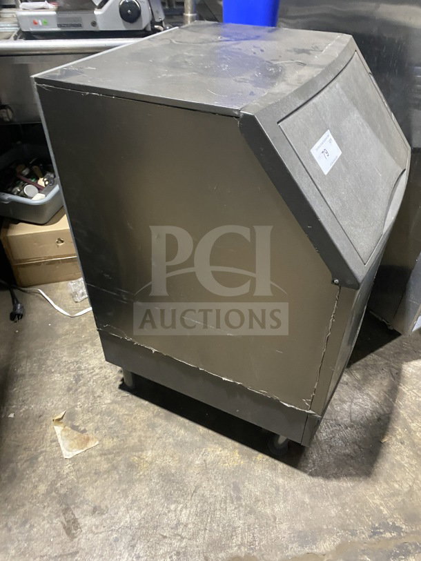 Manitowoc stainless steel ice machine, model UYF0140A-161B. Used condition, visible wear. 115V, 1 phase, with bin.
