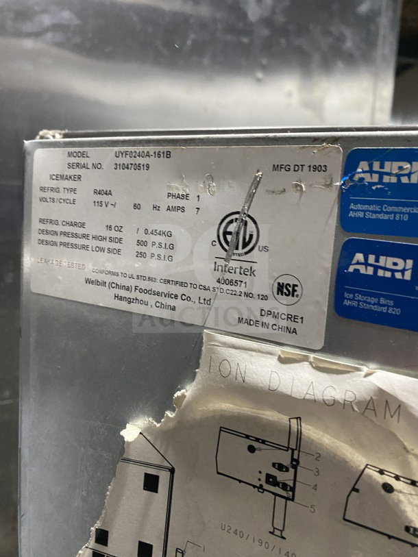Manitowoc UYF0140A-161B ice machine label, displaying model, serial number, and electrical specs. Stainless steel, air-cooled.