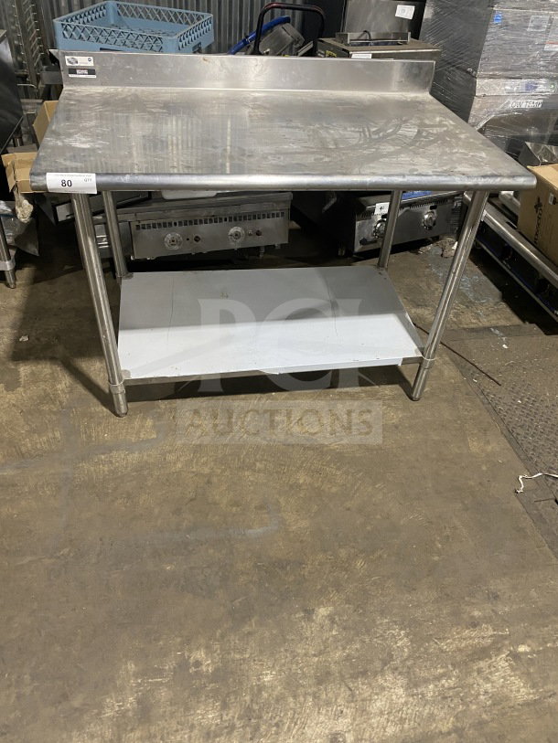 Sauber Select PA7348 stainless steel worktop table with single shelf, backsplash, and legs. Used condition, model labeled.
