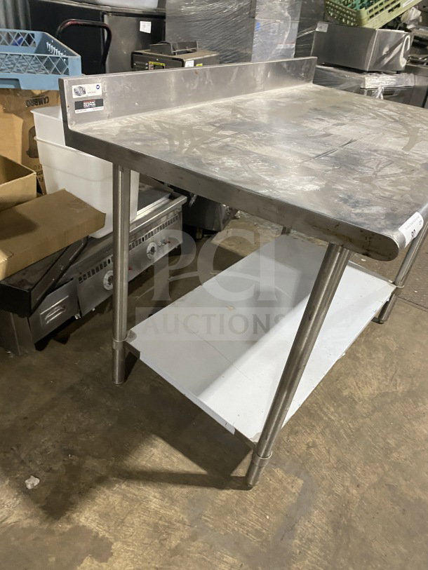 Sauber Select PA7348 stainless steel worktop table with single shelf and backsplash, on legs, used condition.