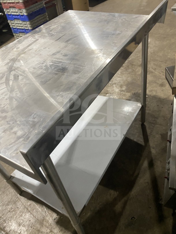 Sauber Select PA7348 stainless steel worktop table with backsplash, single shelf, on legs, used condition.
