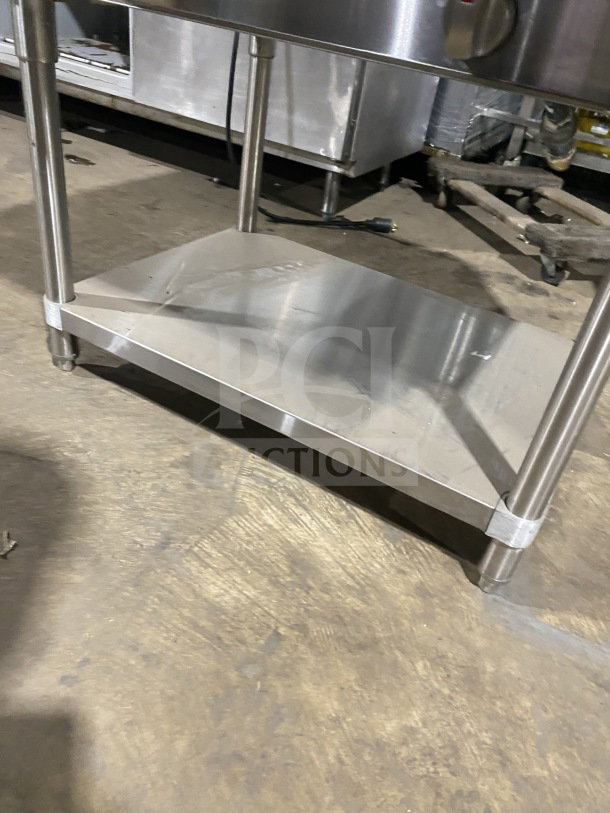 Prepline stainless steel two-well gas steam table with sneeze guard and undershelf on legs, shown in good condition.