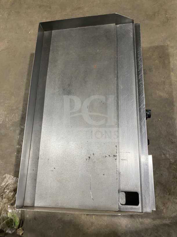 Commercial stainless steel electric countertop griddle with side and back splash, on legs, good condition.