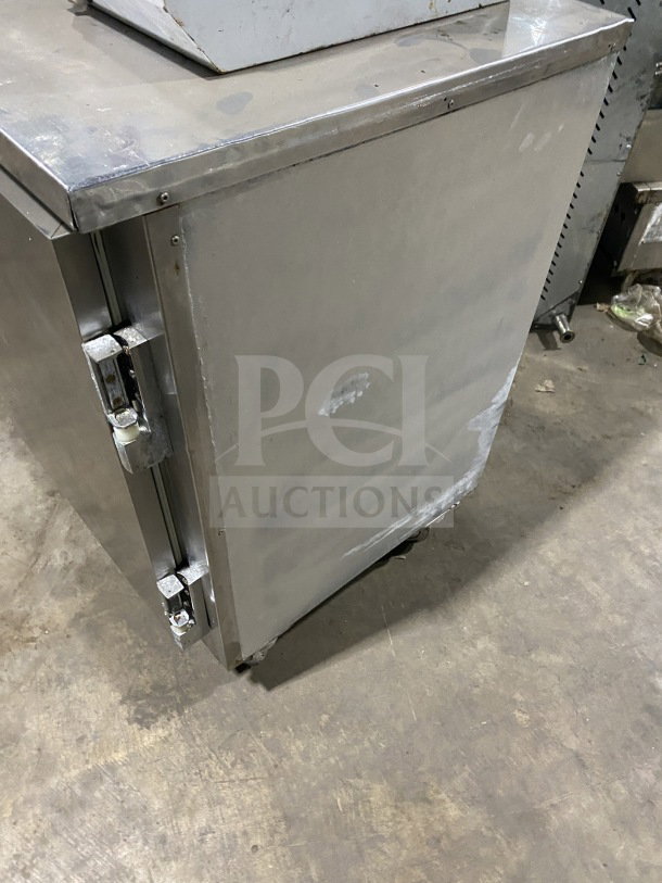 Leader LB48SC stainless steel 2-door lowboy refrigerator on casters, includes chrome plated wire rack. Visible wear on surface.