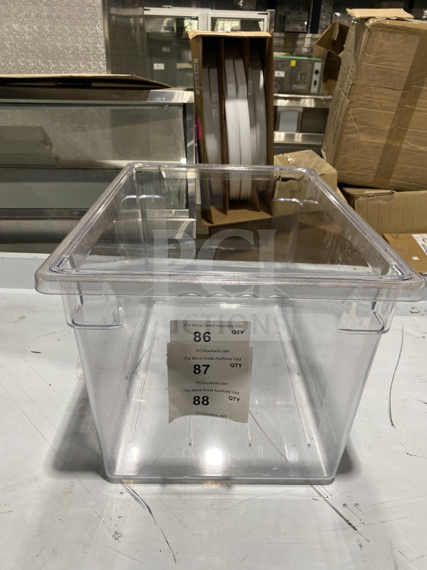 Clear full-size polypropylene food pan, commercial grade. New condition. Auction tags with lot numbers 86, 87, 88 visible.