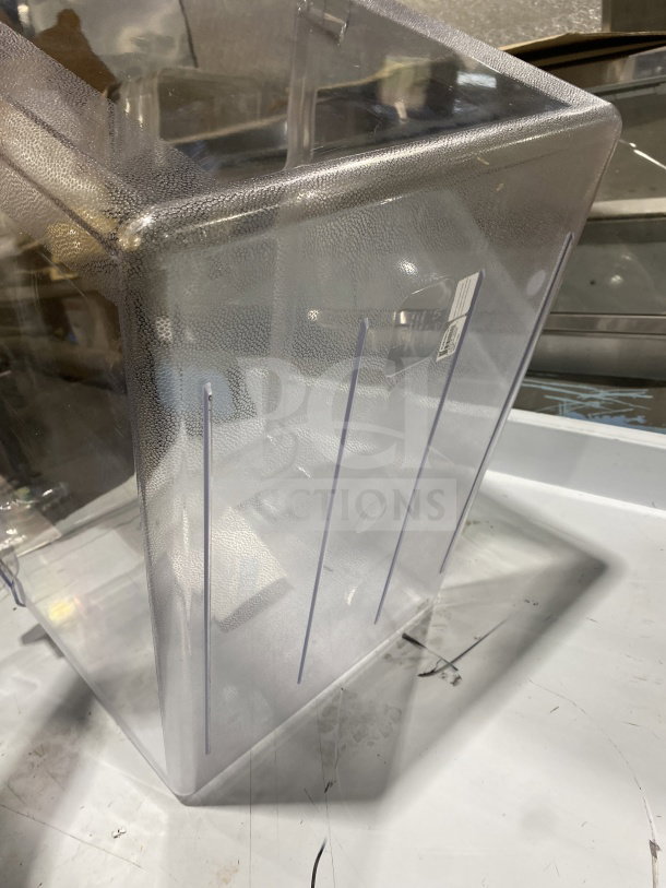 Clear polypropylene full-size commercial food pan, textured surface, with measurement markings, in excellent condition.