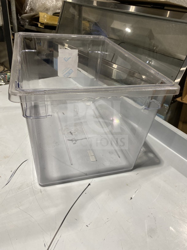 Commercial full-size clear plastic food pan, made of polypropylene, shows slight wear, suitable for catering or storage.