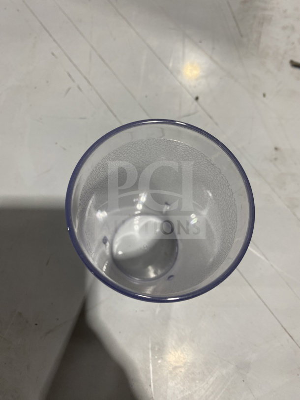 Clear plastic pebbled tumbler, 16 oz, Winco PTP-16C, new condition, top view showing texture.