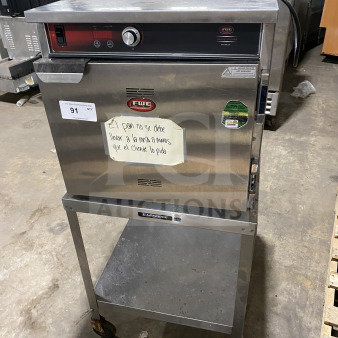FWE Handy Line Series stainless steel 4-pan heated cabinet, model HLC18264, electric, on casters, with equipment stand.