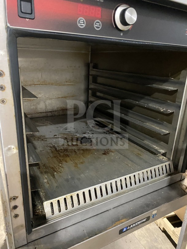 FWE HLC18264 countertop warming cabinet on casters, stainless steel, holds 4 pans, includes digital controls, used condition.