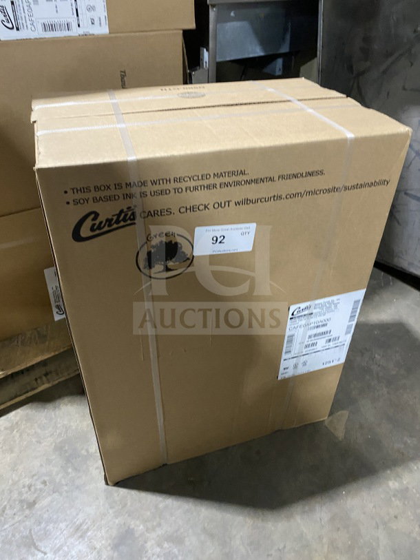 Curtis countertop coffee brewing machine in original box, model CAFEOAP10A000, brand new, 120V, visible serial number 15160857.