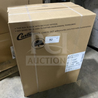 Curtis countertop coffee brewing machine in original box, model CAFEOAP10A000, brand new, 120V, visible serial number 15160857.