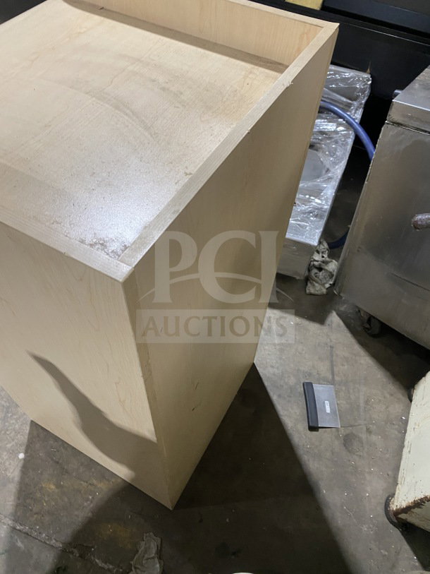 Commercial wooden waste enclosure and tray holder station, fast-casual style. Light wood finish, good condition.