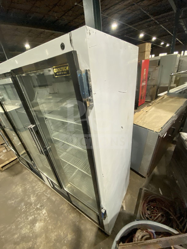 CoolTech CUST96PGR reach-in refrigerator/freezer with 4 glass doors, poly coated racks, 120V, white finish, shown in warehouse.