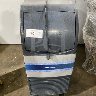 Scotsman commercial undercounter ice maker with built-in storage, electric powered, on casters, fair condition, auction tag visible.