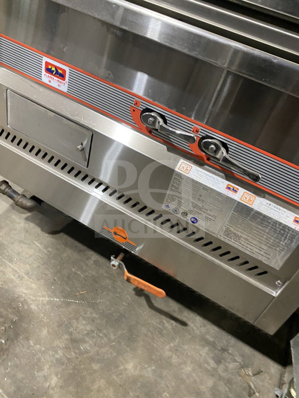 Flame-Mate ESC3NN commercial stainless steel steam cabinet, natural gas, 3 compartments, on legs, model label visible.