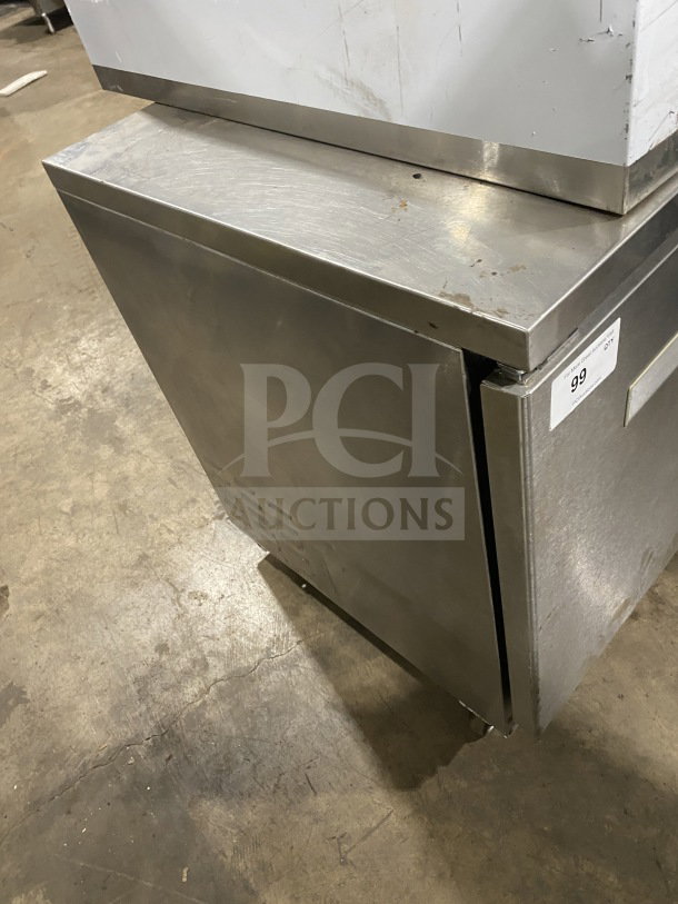 Fagor FUR-27 stainless steel undercounter refrigerator with poly coated wired rack, on casters, slight wear, Model SN: 07070051M.