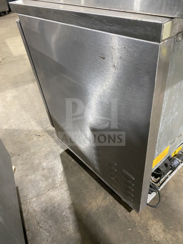 Fagor FUR-27 stainless steel undercounter refrigerator on casters, single door, poly-coated rack, minor surface wear.