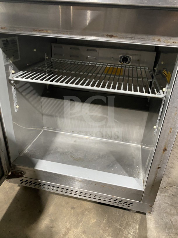 Fagor Commercial Stainless Steel Refrigerator, Model FUR-27, with poly coated rack, SN: 07070051M, on casters, 115V, 1 Phase.